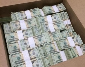 Box Full Of Stacks Of Dollar Bills
