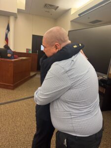 Defendant hugging ChristyJack after the Not Guilty Verdict